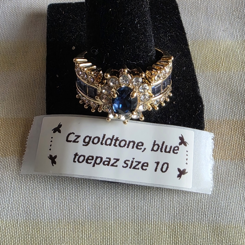 Goldtone Ring with Blue Topaz Accent